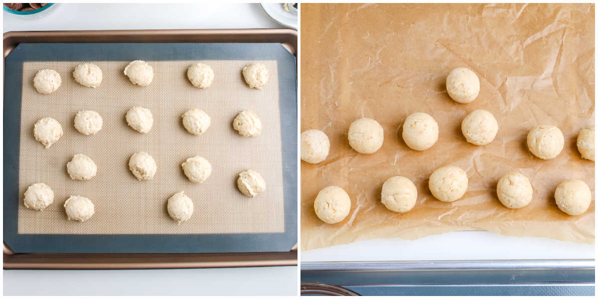 Rows of scooped and rolled cheesecake truffle balls chilling on a lined baking sheet in preparation for dipping in chocolate.