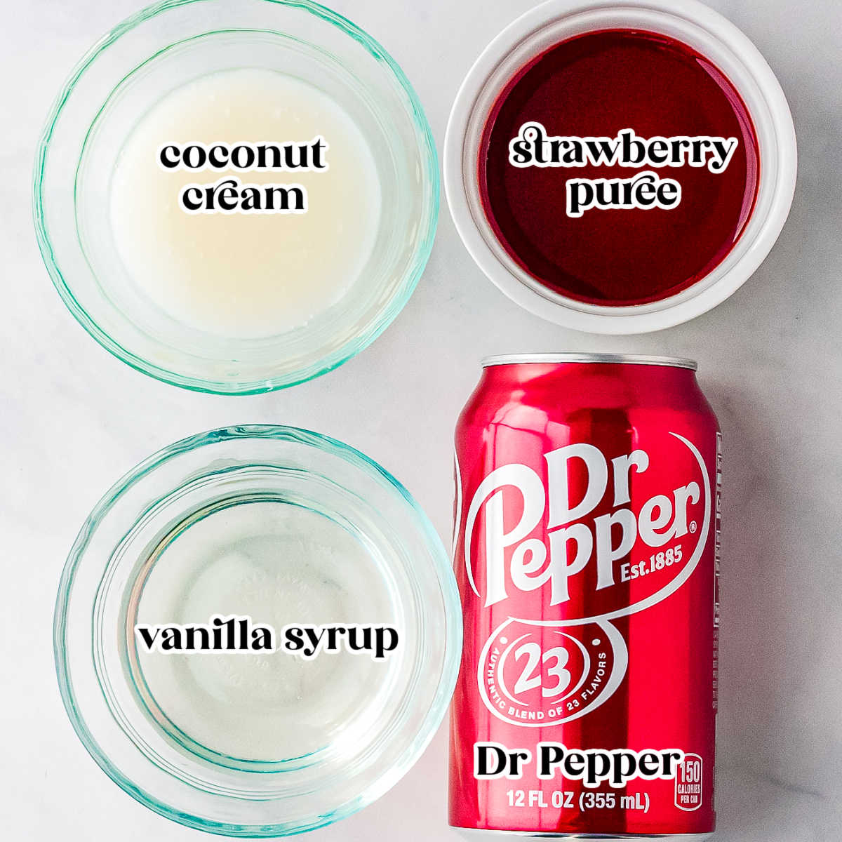 Ingredients for a Valentine&rsquo;s dirty Dr Pepper including coconut cream, strawberry puree, vanilla syrup, and a can of Dr Pepper arranged on a light background.